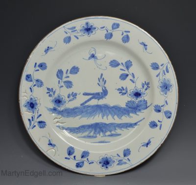 Liverpool delft charger decorated in blue with a peacock, circa 1760