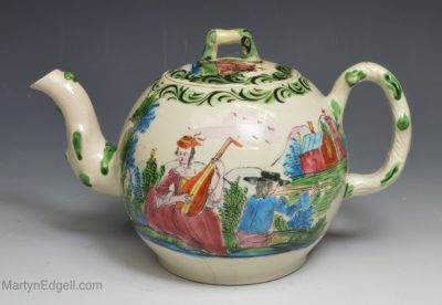 Staffordshire saltglaze stoneware teapot decorated with overglaze enamels, circa 1760