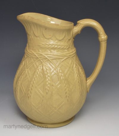 Relief moulded stoneware jug, circa 1850, probably Ridgeways