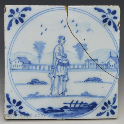 Bristol delft tile decorated with a lady carrying a basket, circa 1750