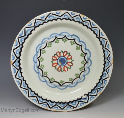 London delft polychrome pancake plate, circa 1740