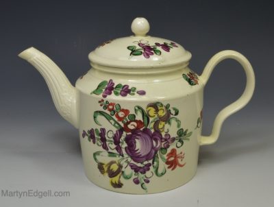 Creamware pottery teapot decorated in florals painted over the glaze, circa 1770