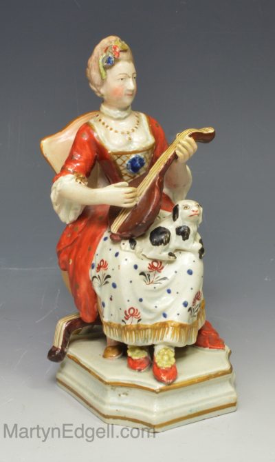 Staffordshire pearlware pottery figure of a Lady playing the lute, circa 1830