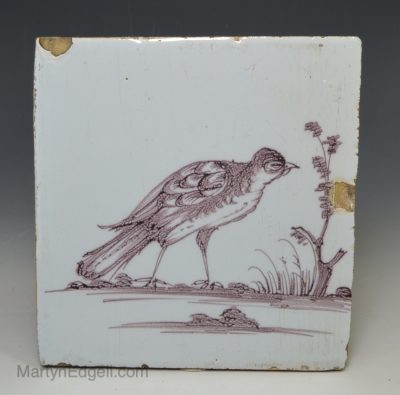 Liverpool delft tile decorated with a bird in manganese, circa 1760