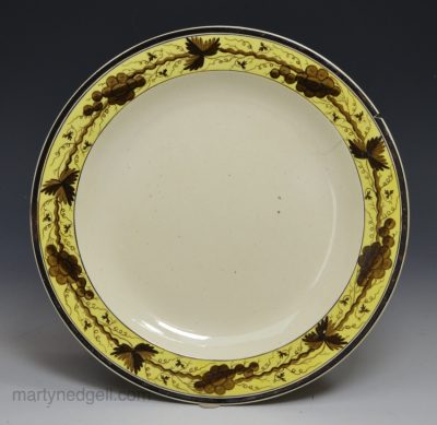 Creamware pottery plate decorated over the glaze, circa 1790
