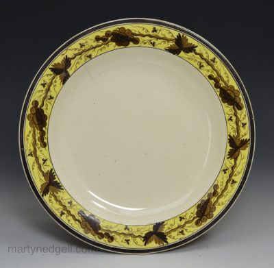 Creamware pottery plate decorated over the glaze, circa 1790