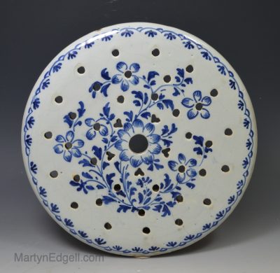 London delft strainer painted with blue florals, circa 1750