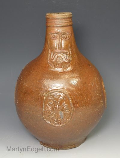 Brown saltglaze stoneware bellarmine jug, circa 1600