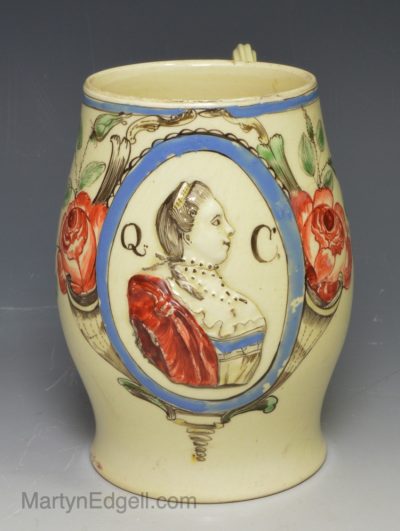 Creamware pottery jug moulded with Queen Charlotte, circa 1770
