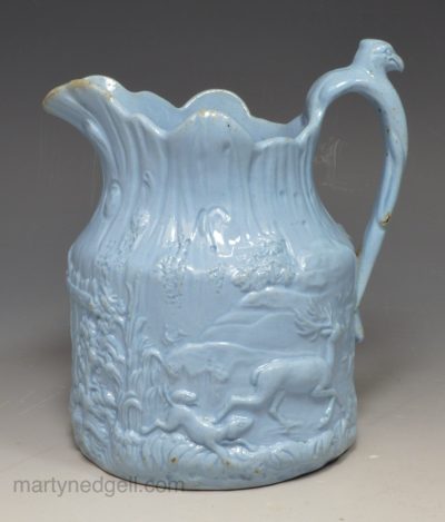 Blue pottery moulded relief jug, circa 1850