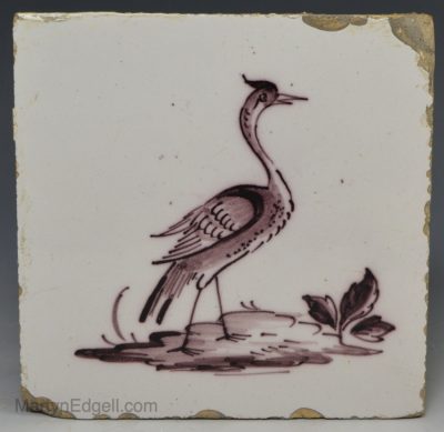 Liverpool delft tile painted with an exoctic bird in manganese, circa 1750