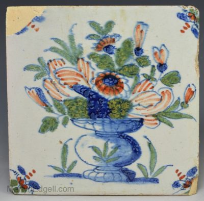 London delft tile decorated in blue, red and green florals, circa 1730