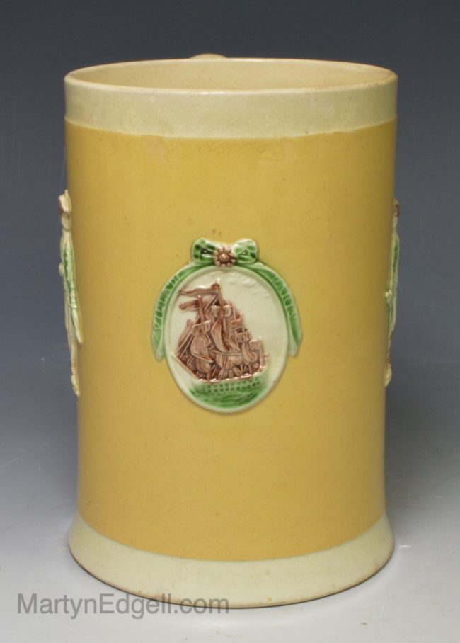 Creamware pottery mug commemorating the battle of the Saints moulded with Admiral Rodney and Admiral Sir Samuel Hood, circa 1785