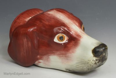 Staffordshire pearlware pottery hounds head stirrup cup, circa 1850