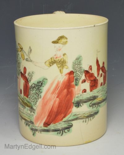 Creamware pottery mug decorated with enamels over the glaze, circa 1770