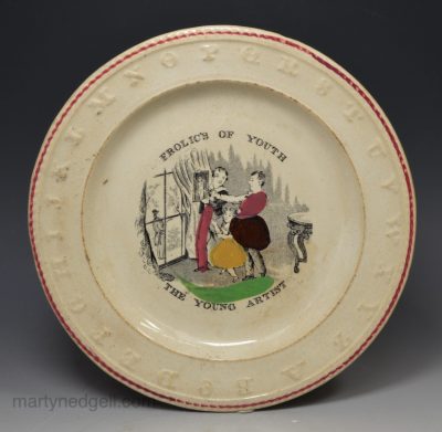 creamware pottery child's plate 'THE YOUNG ARTIST', circa 1840