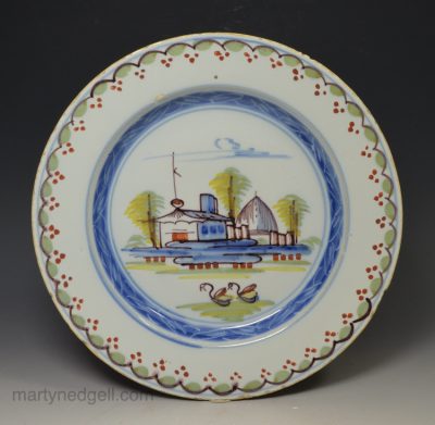 London delft plate decorated with colour of a landscape, circa 1760