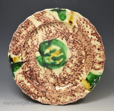 Creamware pottery plate decorated with Whieldon type colours under the glaze, circa 1770