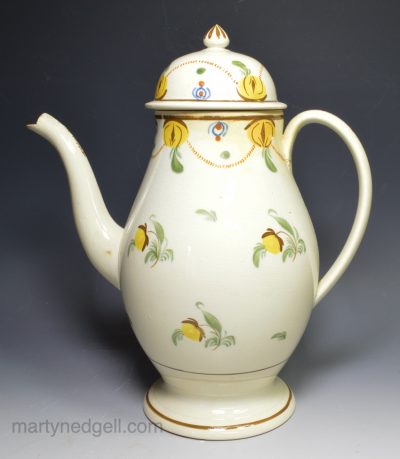 Prattware pottery coffee pot decorated with colours under a pearlware glaze, circa 1820