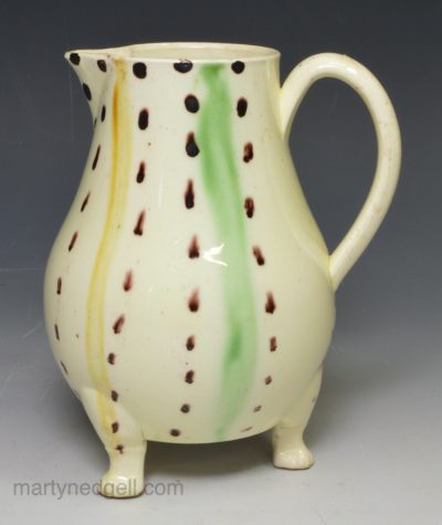 Creamware pottery jug decorated in stripes under the glaze, circa 1770