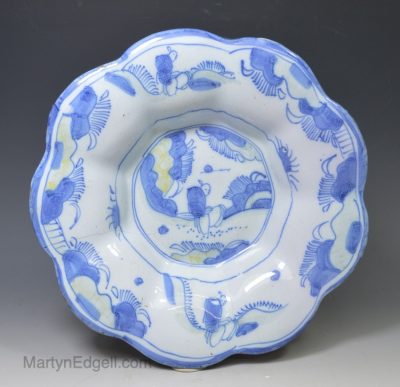 London delft buckle dish decorated with blue and yellow, circa 1690