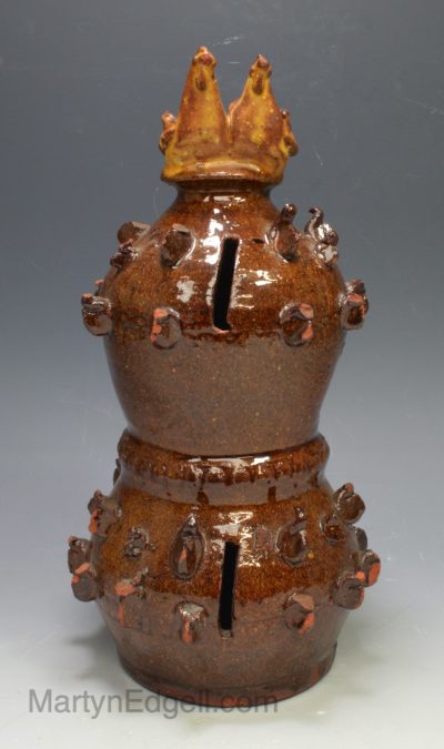 Slipware money box decorated with two chickens on the top, circa 1850, probably Yorkshire