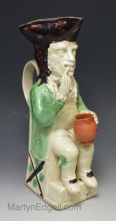 Pearlware pottery Thin Man Toby jug decorated with colours under the glaze, circa 1770