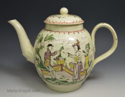Large creamware pottery marriage teapot decorated with enamels over the glaze, circa 1790