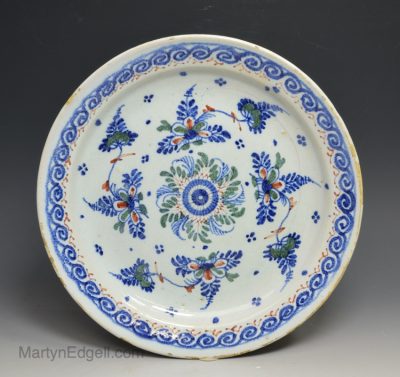 Bristol delft plate decorated in blue, red and green, circa 1740