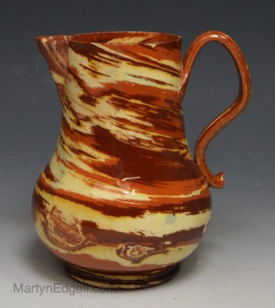 Staffordshire solid agateware pottery jug, circa 1750