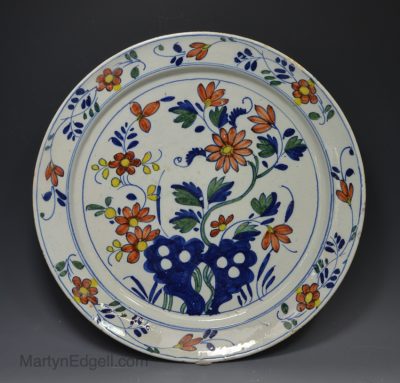 Bristol polychrome delft charger decorated in florals, circa 1740