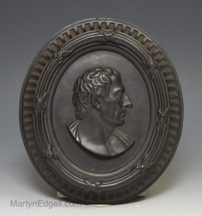 Wedgwood and Bentley black basalt plaque moulded with a philosopher, circa 1785