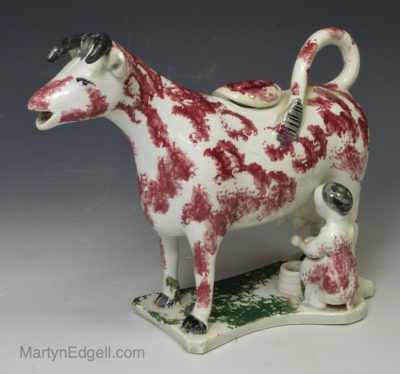 Pearlware pottery cow creamer with sponged decoration, circa 1830