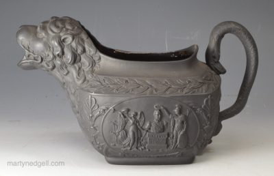 Black basalt lion moulded jug commemorating Wellington, dated 1813