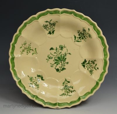 Creamware pottery shallow bowl decorated with enamels over the glaze, circa 1780