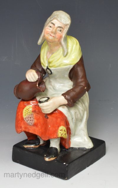 Staffordshire pearlware pottery figure of a lady, circa 1820