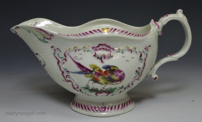 Worcester porcelain sauce boat decorated with enameled exoctic birds over the glaze, circa 1770