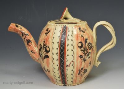 Creamware pottery teapot decorated with stripes over the glaze, circa 1770