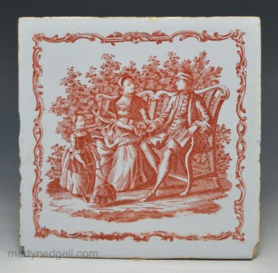 Liverpool delft Sadler printed tile of a lady and gentleman on a seat, with a child playing, circa 1770