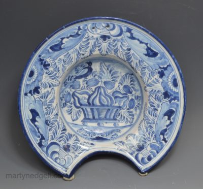 Garman tin glazed barbers bowl decorated in blue with a basket of blue, circa 1740