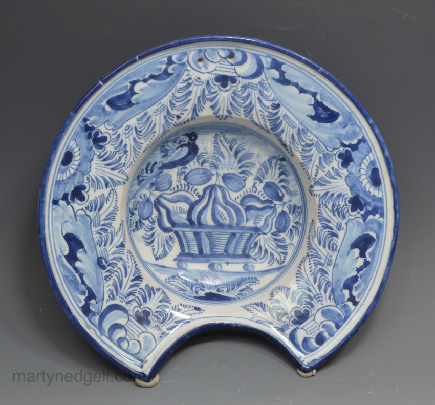 German tin glazed barbers bowl decorated in blue with a basket of fruit, circa 1740
