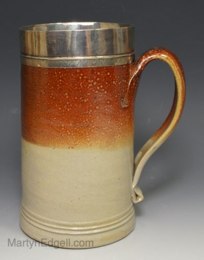 Fulham salt glaze stoneware mug with a silver rim with makers mark 'PH', circa 1720