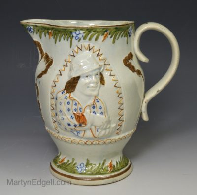 Prattware pottery moulded jug of the Miser, circa 1800
