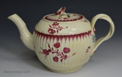 Creamware pottery teapot decorated with enamels over the glaze, circa 1780
