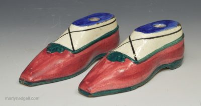 A pair of pearlware pottery inkwells moulded as shoes, circa 1820