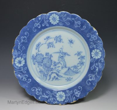 London delft plate decorated with scallop edging with a chinese man, circa 1750
