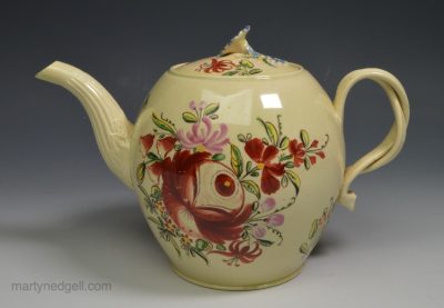 Creamware pottery teapot decorated with enamels over the glaze, circa 1770