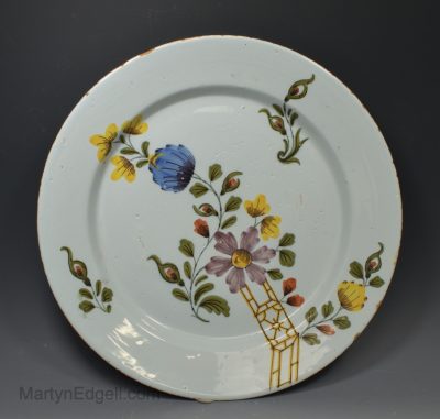 Bristol delft polychrome charger decorated with florals, circa 1750