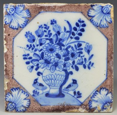 London delft tile decorated with florals and a couple of birds, circa 1740