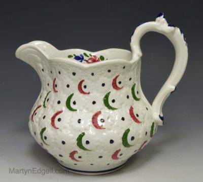 Pearlware pottery jug moulded with daisies, circa 1870, possibly Scottish